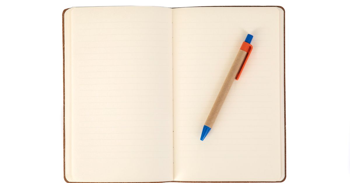 blank notebook open pen